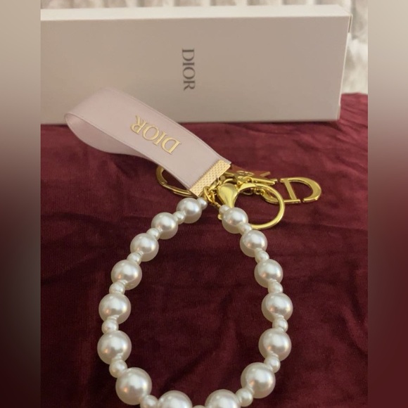 Dior Accessories - Dior White Pearl key chain/ bag charm  with Gold Charms with Dior box NIB